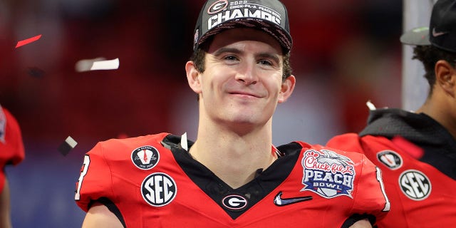 The Georgia Bulldogs celebrate after defeating the Ohio State Buckeyes in the Chick-fil-A Peach Bowl on Dec. 31, 2022, in Atlanta.