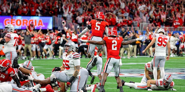 Ohio State Buckeyes' Noah Ruggles #95 reacts after missing a field goal in the final seconds of the game against the Georgia Bulldogs at Chick-fil-A Peach Bowl at Mercedes-Benz Stadium on December 31, 2022 in Atlanta, Georgia . 