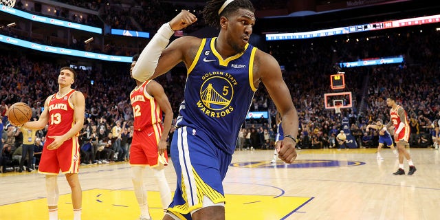 The Warriors' Kevon Looney reacts after he made the game-winning shot at double overtime to beat the Hawks on January 2, 2023.