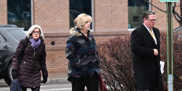 Megan Hess, center, arrives to the Wayne Aspinall Courthouse with her attorneys for her sentencing trial on Jan. 3, 2023 in Grand Junction, Colorado.