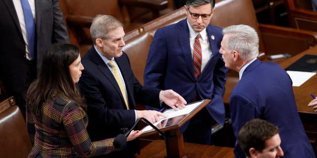 (LR) US Rep. Elise Stefanik (D-NY), Rep. Jim Jordan (R-OH), Rep. Mike Johnson (R-LA) and House Minority Leader Kevin McCarthy (R-CA) talk as the House of Representatives holds their vote for Speaker of the House on the first day of the 118th Congress in the House Chamber of the US Capitol Building on January 03, 2023, in Washington, DC