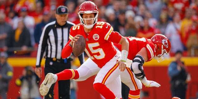 Patrick Mahomes #15 of the Kansas City Chiefs escapes defensive pressure from the Denver Broncos during the second quarter at Arrowhead Stadium on January 1, 2023 in Kansas City, Missouri. 