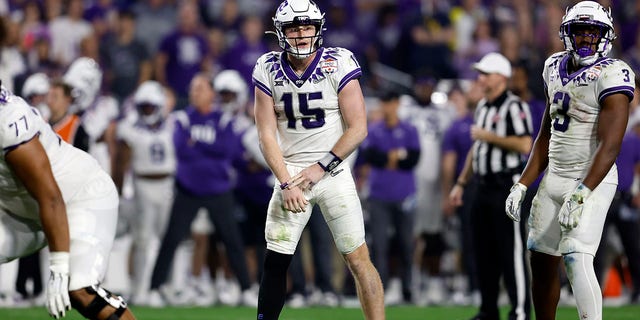 TCU Horned Frogs quarterback Max Duggan, #15, gestures during the second half of the Vrbo Fiesta Bowl against the Michigan Wolverines at State Farm Stadium on December 31, 2022 in Glendale, Arizona. 