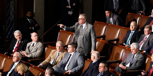 Rep.-elect Mike Bost , R-Ill., yells out as Rep.-elect Matt Gaetz, R-Fla., delivers remarks in the House Chamber during the fourth day of elections for speaker of the House at the U.S. Capitol Building in Washington, D.C., on Friday.