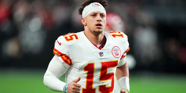 Patrick Mahomes runs onto the field against the Raiders