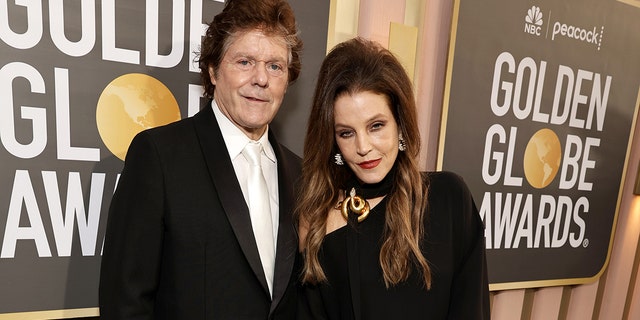 Jerry Schilling, left, and Lisa Marie Presley arrive at the 80th Annual Golden Globe Awards held at the Beverly Hilton Hotel on January 10, 2023 in Beverly Hills, California. 