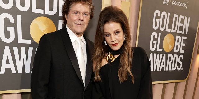 Jerry Schilling, left, and Lisa Marie Presley arrive at the 80th Annual Golden Globe Awards held at the Beverly Hilton Hotel on Jan. 10, 2023 in Beverly Hills, California. 