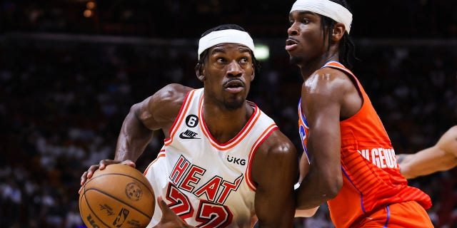 Heat's Jimmy Butler drives against Oklahoma City Thunder's Shai Gilgeous-Alexander at FTX Arena on January 10, 2023 in Miami.