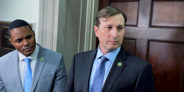 Reps. Ritchie Torres and Daniel Goldman speak to reporters outside the office of Rep. George Santos on January 10, 2023.