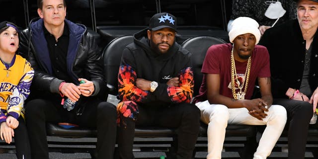 Floyd Mayweather Jr. (C) attends a basketball game between the Los Angeles Lakers and the Dallas Mavericks at Crypto.com Arena on January 12, 2023, in Los Angeles, California.