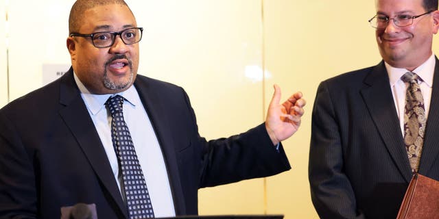 Manhattan District Attorney Alvin Bragg, left, speaks at a press conference after the sentencing hearing of the Trump Organization at the New York Supreme Court in New York City on Jan. 13, 2023.