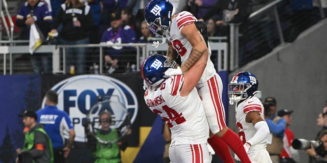 Isaiah Hodgins of the New York Giants celebrates after scoring a touchdown against the Minnesota Vikings in the NFC wild-card playoff game at U.S. Bank Stadium on Jan. 15, 2023, in Minneapolis.