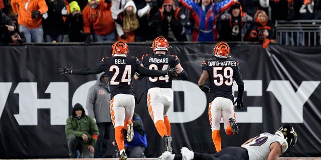 Sam Hubbard #94 of the Cincinnati Bengals scores a 98 yard touchdown off of a recovered fumble by Tyler Huntley #2 of the Baltimore Ravens during the fourth quarter in the AFC Wild Card playoff game at Paycor Stadium on January 15, 2023 in Cincinnati, Ohio.
