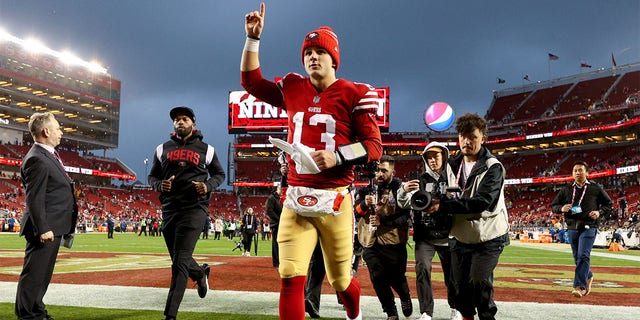 Brock Purdy #13 of the San Francisco 49ers runs off the field after defeating the Seattle Seahawks in the NFC Wild Card playoff game at Levi's Stadium on January 14, 2023, in Santa Clara, California. 