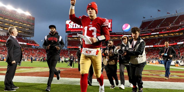 Brock Purdy #13 of the San Francisco 49ers runs off the field after defeating the Seattle Seahawks in the NFC Wild Card playoff game at Levi's Stadium on January 14, 2023, in Santa Clara, California. 