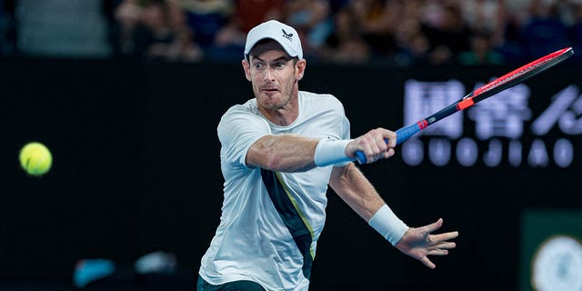 Andy Murray plays a backhand against Matteo Berrettini during the Australian Open on January 17, 2023 in Melbourne.