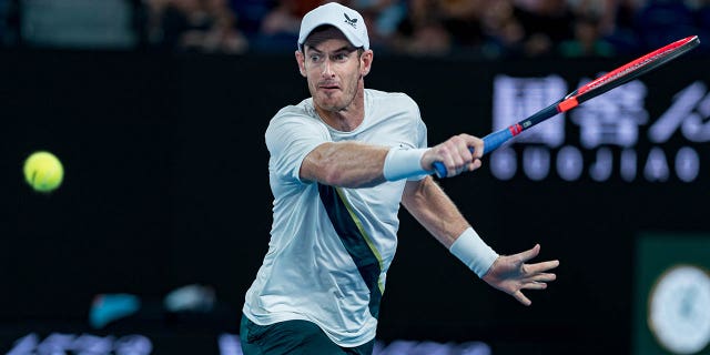 Andy Murray plays a backhand against Matteo Berrettini during the Australian Open on January 17, 2023 in Melbourne.