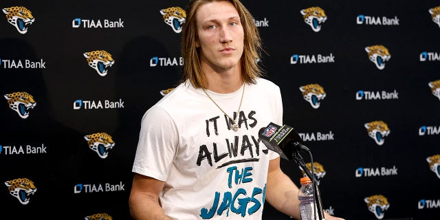 Quarterback Trevor Lawrence of the Jacksonville Jaguars talks with the media during the postgame press conference after winning an AFC wild-card game against the Los Angeles Chargers at TIAA Bank Field Jan. 14, 2023 in Jacksonville, Fla.