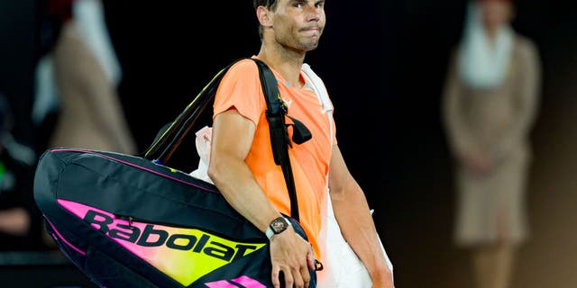 Rafael Nadal acknowledges the crowd after losing to Mackenzie McDonald during the Australian Open on January 18, 2023 in Melbourne.