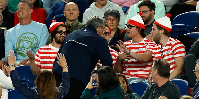 Fans in the crowd dressed as 'Where's Waldo?'  Costumes are seen during the Djokovic-Couacauo match at Rod Laver Arena during the Australian Open on January 19, 2023 in Melbourne.