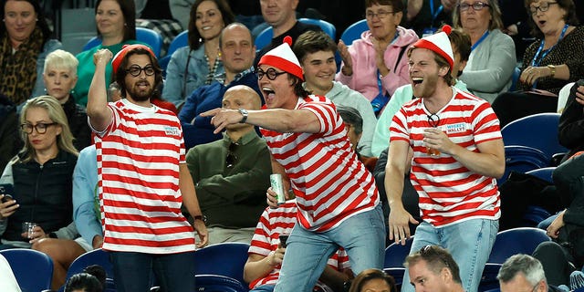 Fans in the crowd dressed as 'Where's Waldo?'  Costumes are seen during the match between Novak Djokovic and Enzo Couacauo at the Australian Open on January 19, 2023 in Melbourne.
