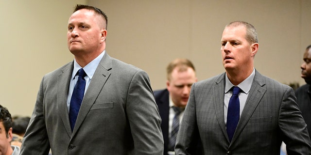Paramedics Jeremy Cooper, left, and Peter Cichuniec, right, at an arraignment in the Adams County district court at the Adams County Justice Center January 20, 2023. 