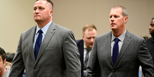 Paramedics Jeremy Cooper, left, and Peter Cichuniec, right, at an arraignment in the Adams County district court at the Adams County Justice Center January 20, 2023. 