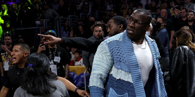 LOS ANGELES, CALIFORNIA - JANUARY 20: Shannon Sharpe reacts after being pinned for safety by Memphis Grizzlies number 12 Ja Morant, following a verbal altercation after the first half against the Los Angeles Lakers at Crypto.com Arena January 20.  2023, in Los Angeles, California. 