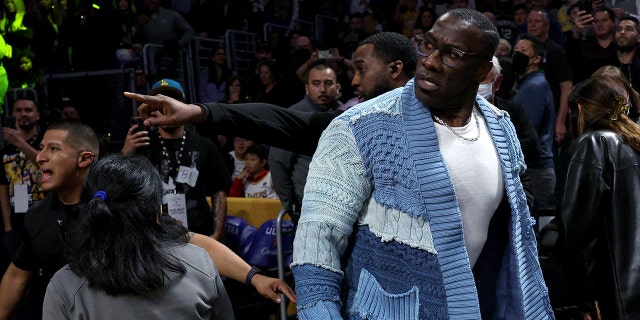 Shannon Sharpe reacts after he is restrained by security from Ja Morant #12 of the Memphis Grizzlies after a verbal altercation after the first half against the Los Angeles Lakers at Crypto.com Arena on January 20, 2023, in Los Angeles, California.