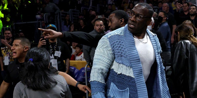 LOS ANGELES, CALIFORNIA - JANUARY 20: Shannon Sharpe reacts after being pinned for safety by Memphis Grizzlies number 12 Ja Morant, following a verbal altercation after the first half against the Los Angeles Lakers at Crypto.com Arena January 20.  2023, in Los Angeles, California. 