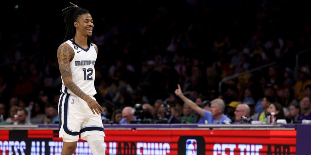 LOS ANGELES, CALIFORNIA - JANUARY 20: Ja Morant #12 of the Memphis Grizzlies reacts as he walks to the bench during the first half against the Los Angeles Lakers at Crypto.com Arena on January 20, 2023 in Los Angeles, California.