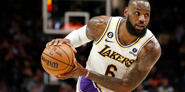 LeBron James of the Los Angeles Lakers looks to pass against the Trail Blazers at the Moda Center on January 22, 2023 in Portland, Oregon.