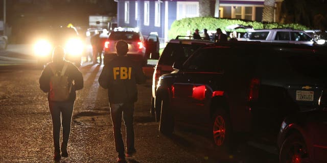 FBI agents arrive at the scene of a shooting on Jan. 23, 2023, in Half Moon Bay, California.