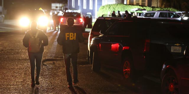 FBI agents arrive at the scene of a shooting on Jan. 23, 2023, in Half Moon Bay, California.