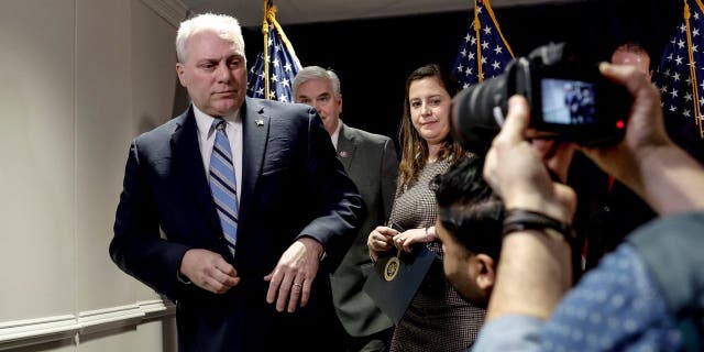 House Majority Leader Steve Scalise, left, departs after a press conference at the RNC headquarters on Capitol Hill on Jan. 25, 2023, in Washington, D.C.