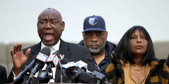 Flanked by Rodney Wells (C) and RowVaughn Wells, the stepfather and mother of Tyre Nichols, civil rights attorney Ben Crump speaks during a press conference on January 27, 2023 in Memphis, Tennessee. 