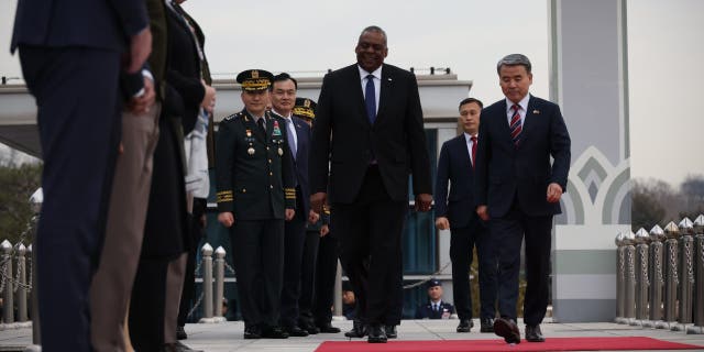 Secretary of Defense Lloyd Austin, center, and South Korean Defense Minister Lee Jong-sup, right, attend a welcome ceremony at the Defense Ministry on Jan. 31, 2023, in Seoul, South Korea.