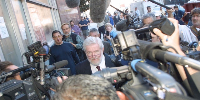 Defense attorney George Parnham arrives at the Harris County 230th District Court in Houston on Aug. 8, 2001, for the arraignment of his client, Andrea Yates, who was charged with the drowning deaths of her five children.