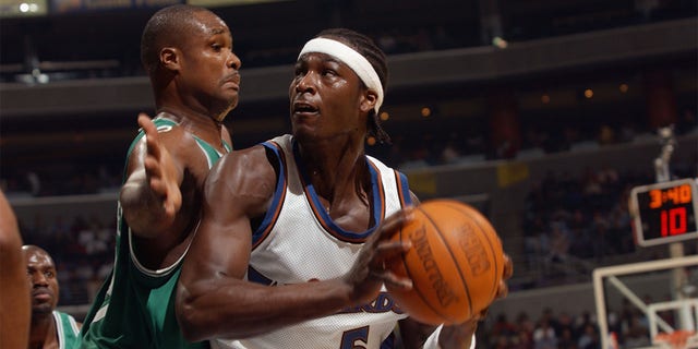Kwame Brown of the Wizards is defended by Antoine Walker of the Boston Celtics at the MCI Center on October 31, 2002 in Washington, DC.
