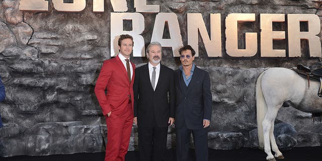 Armie Hammer, Gore Verbinski and Johnny Depp attend the U.K. premiere of "The Lone Ranger" at Odeon Leicester Square on July 21, 2013, in London.  