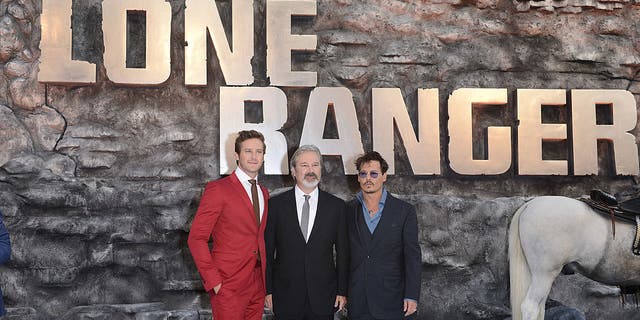 Armie Hammer, Gore Verbinski and Johnny Depp attend the U.K. premiere of "The Lone Ranger" at Odeon Leicester Square on July 21, 2013, in London.  