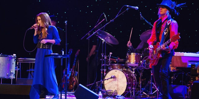 Lisa Marie Presley and performs on stage with husband and guitarist Michael Lockwood at the Triple Door Theater on August 28, 2013 in Seattle, Washington. 