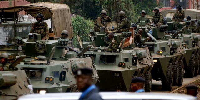 NAIROBI, KENYA - SEPTEMBER 25: (SOUTH AFRICA OUT)  KDF Officers leave the Westgate Mall on September 25, 2013 in Nairobi, Kenya. The Mall was hit with a terrorist attack on Saturday, 10-15 gunmen from the extremist group Al-Shabab entered the mall and opened fire at random on shoppers; 68 deaths have been confirmed.  