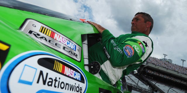 Hermie Sadler III, driver of the #19 VA Lottery Toyota, climbs into his car on the grid during qualifying for the NASCAR Nationwide Series Virginia529 College Savings 250 at Richmond International Raceway on September 5, 2014 in Richmond, Virginia.