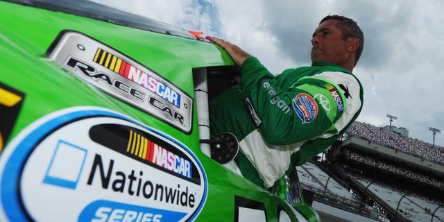 Hermie Sadler III, driver of the #19 VA Lottery Toyota, climbs into his car on the grid during qualifying for the NASCAR Nationwide Series Virginia529 College Savings 250 at Richmond International Raceway on September 5, 2014 in Richmond, Virginia.
