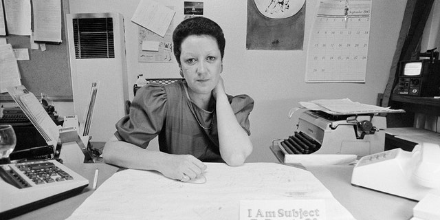 Norma McCorvey, the "Jane Roe" in the 1973 Roe v. Wade court case, is shown sitting behind her desk with a sign displayed that says "I Am Subject To Bursts Of Enthusiasm." She was 22 and pregnant for the third time in 1969 when she fought for the right to have an abortion. She never had that abortion. 