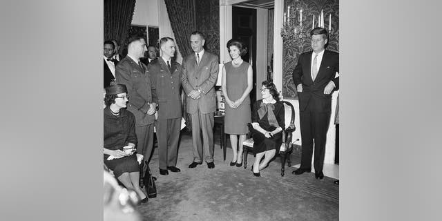 Released captains: John McKone, Bruce Olmstead, and their wives are honored at the White House by (left to right) Vice President Lyndon Johnson, first lady Jacqueline Kennedy and President John F. Kennedy. The RB-47 bomber flown by the U.S. airmen was shot down by a Soviet MiG fighter.