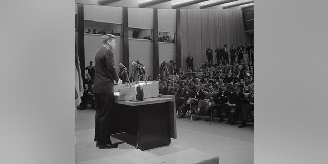 Semi-general view of press conference in Washington, D.C., as President Kennedy is shown at his first press conference since taking office. At the conference, which was televised live from the State Department's new auditorium, the president said he was asking that the Geneva negotiations with Russia for a nuclear test ban treaty be postponed until late March.