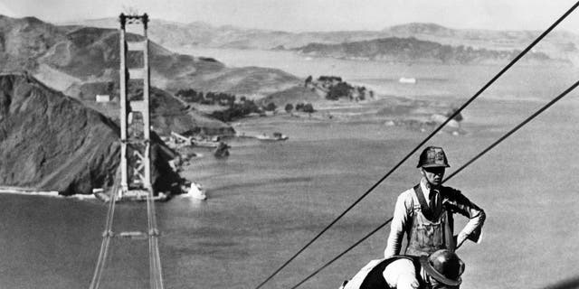 Picture dated October 1935 of the Golden Gate Bridge, in the San Francisco Bay, during construction. The construction began on January 5, 1933, and the bridge was inaugurated on May 27, 1937, by Franklin Delano Roosevelt, who pushed a button in Washington, D.C., signaling the official start of vehicle traffic over the bridge. The idea of engineer Joseph Strauss, it was the largest suspension bridge in the world.