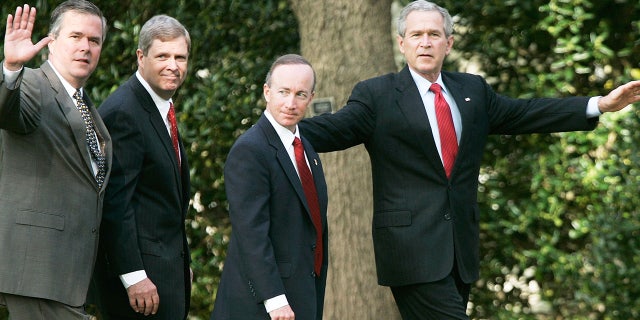 Former President George W. Bush, right, walks with governors after speaking to the press on the war on terror April 19, 2006 at the White House in Washington, D.C.